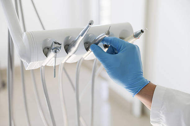 Professional Tooth Extraction technician working in Bay City, MI